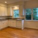 Kitchen has been updated w/new cabinets & granite counters. It is large enough for a breakfast room table.