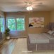 Primary bedroom is AWESOME!  It's BIG & has a HUGE walk in closet and walls of windows plus an en suite bath.