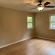 Primary bedroom has great windows, a ceiling fan and an ensuite bath.