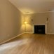 Spacious family room with volume ceilings and wood burning fireplace.
