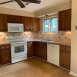 Another view of the kitchen, it also has a ceiling fan & adjacent breakfast area.
