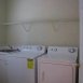 There is an acutal laundry room with a laundry sink.