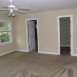Primary bedroom has a walk in closet, ceiling fan and luxury bath.