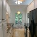 Kitchen has good cabinet & counter space, all appliances including a built in microwave & also has a pantry cupboard.
