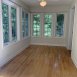The sunroom overlooks the back yard-flexible space-home office, playroom, tv room ....