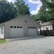 Home has an oversized detached garage with storage.