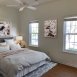 Another bedroom-also with a ceiling fan & wood floors.