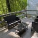 Rear deck is great place to relax & unwind, backs to woods..