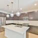 Another view of the kitchen-island is amazing space & has room for stools.