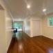 Den/ Dining area (fireplace behind you) leading to kitchen